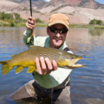 Man Fly Fishing Catches Trout